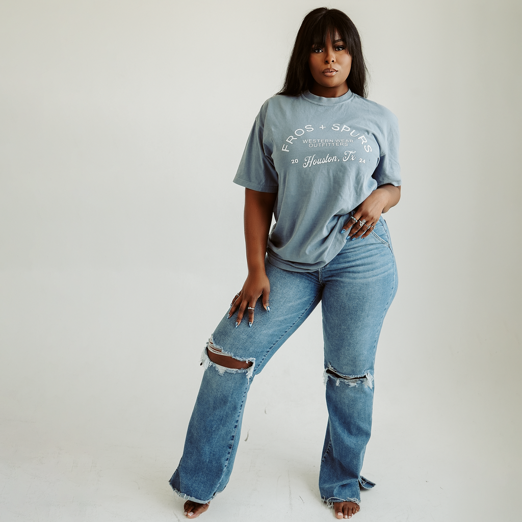 Fros and Spurs Western Wear Outfitters blue Western graphic T-shirt with white Houston Texas lettering