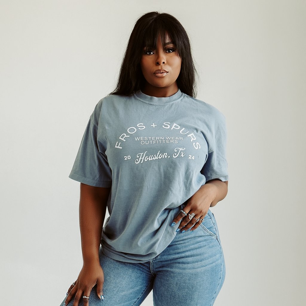 Fros and Spurs Western Wear Outfitters blue Western graphic T-shirt with white Houston Texas lettering
